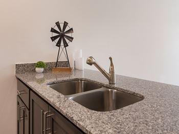 Kitchen with appliances and sink at Ardmore at the Trail, Indian Trail, North Carolina